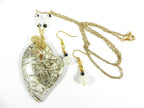 Tree Agate Heart Shaped Gemstone Pendant Gold Wire Wrapped with a White Background and Green and Grey Lines with Matching Earrings