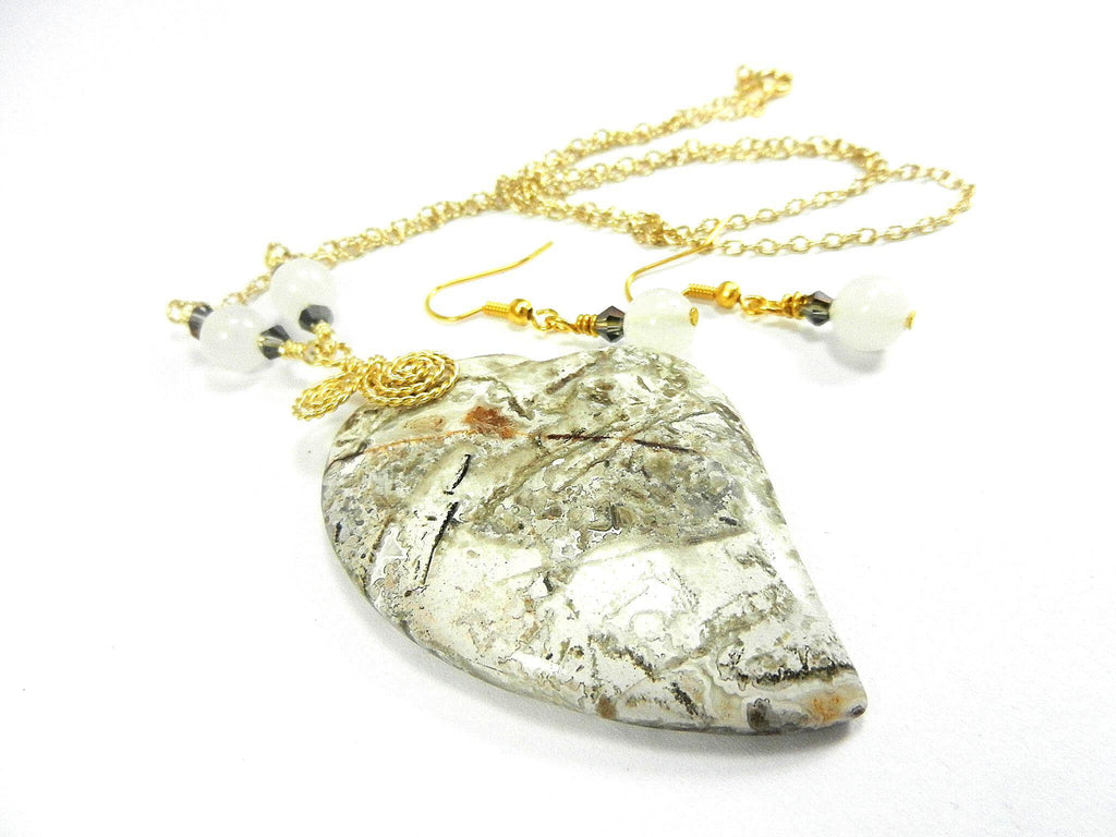 Tree Agate Heart Shaped Gemstone Pendant Gold Wire Wrapped with a White Background and Green and Grey Lines with Matching Earrings