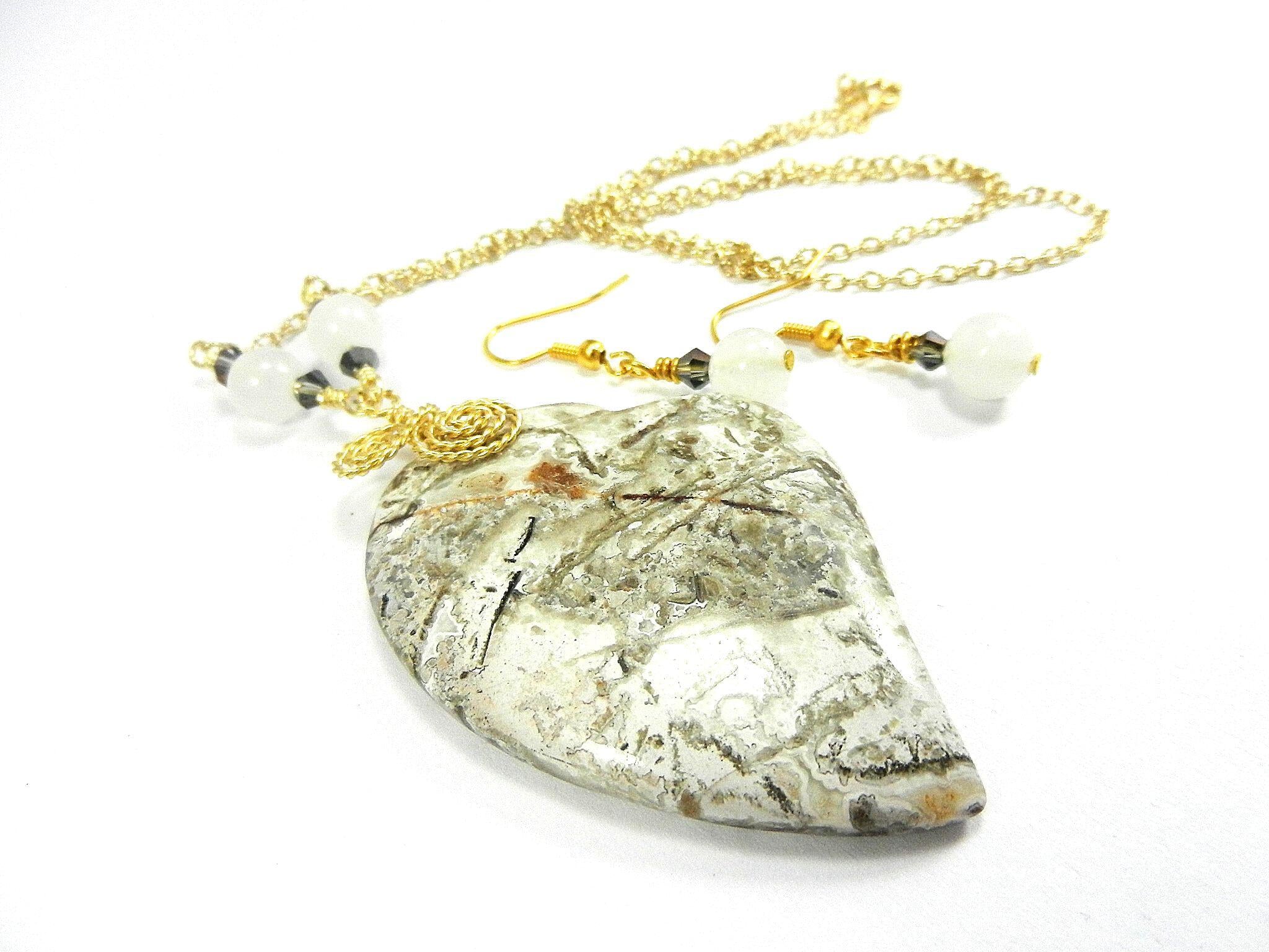 Tree Agate Heart Shaped Gemstone Pendant Gold Wire Wrapped with a White Background and Green and Grey Lines with Matching Earrings