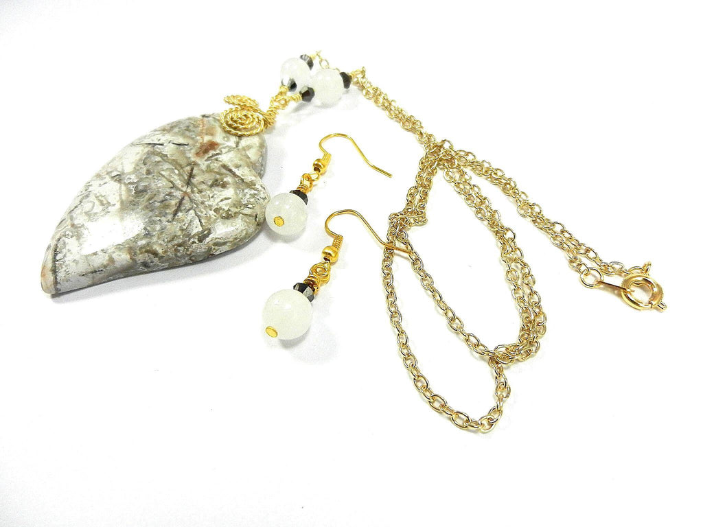 Tree Agate Heart Shaped Gemstone Pendant Gold Wire Wrapped with a White Background and Green and Grey Lines with Matching Earrings