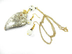 Tree Agate Heart Shaped Gemstone Pendant Gold Wire Wrapped with a White Background and Green and Grey Lines with Matching Earrings