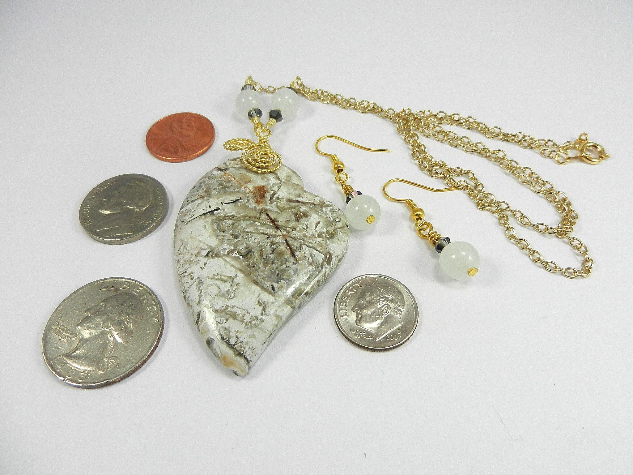 Tree Agate Heart Shaped Gemstone Pendant Gold Wire Wrapped with a White Background and Green and Grey Lines with Matching Earrings