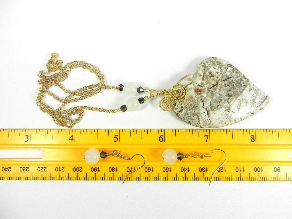 Tree Agate Heart Shaped Gemstone Pendant Gold Wire Wrapped with a White Background and Green and Grey Lines with Matching Earrings