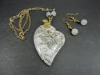 Tree Agate Heart Shaped Gemstone Pendant Gold Wire Wrapped with a White Background and Green and Grey Lines with Matching Earrings