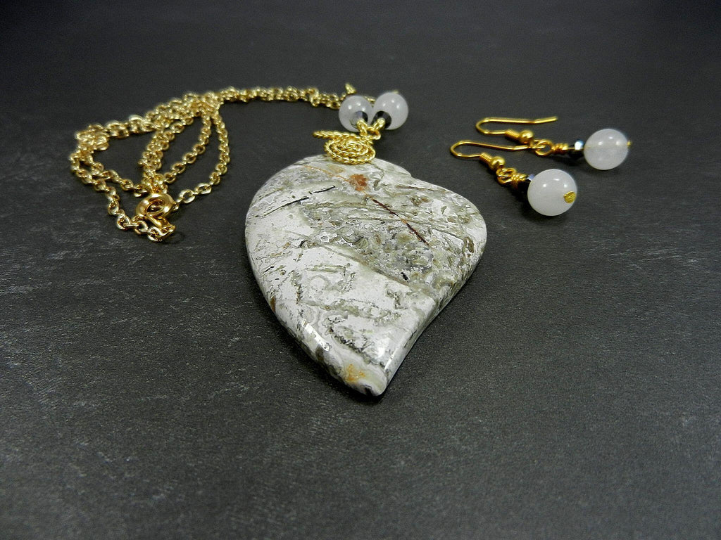 Tree Agate Heart Shaped Gemstone Pendant Gold Wire Wrapped with a White Background and Green and Grey Lines with Matching Earrings