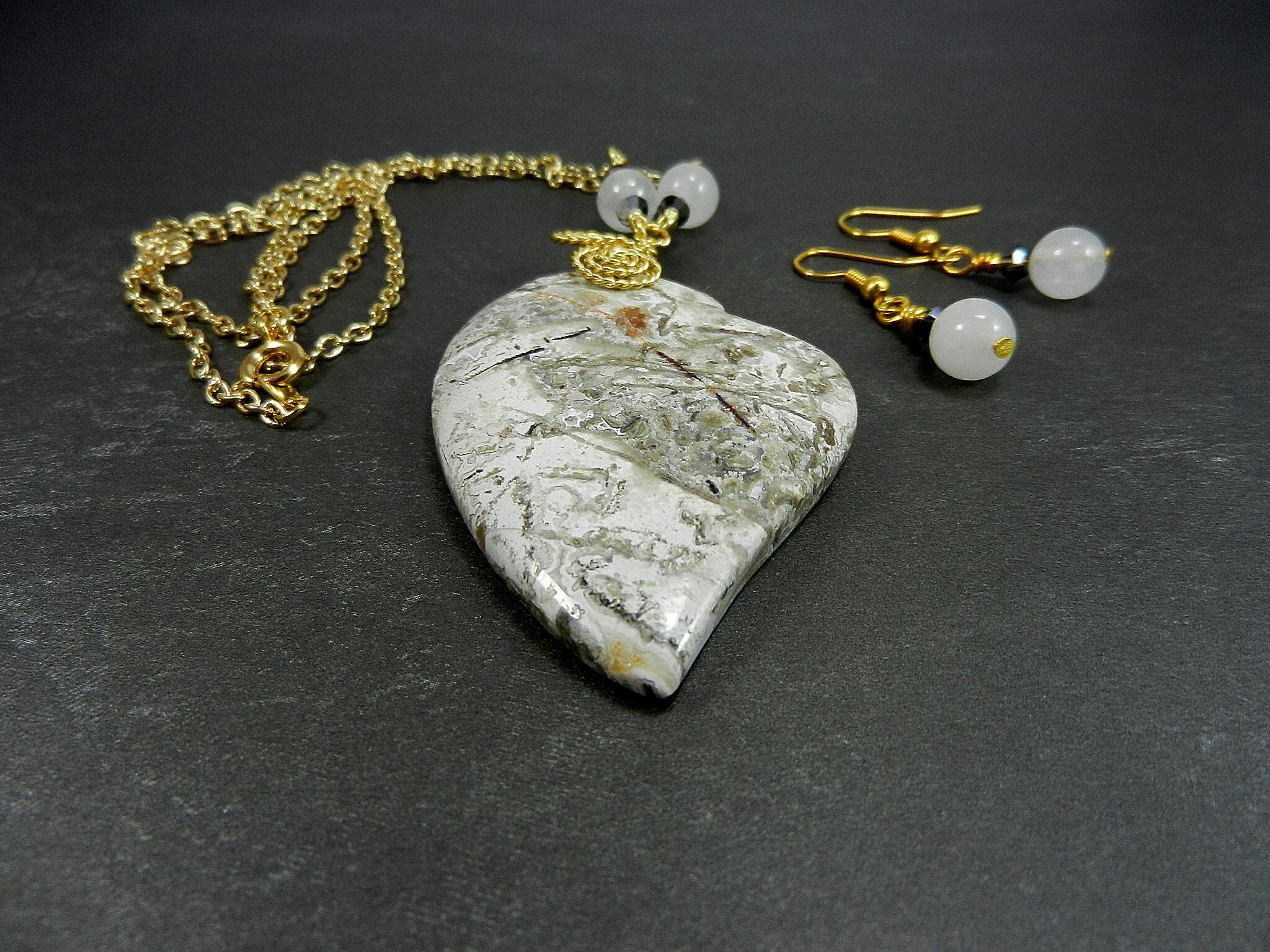 Tree Agate Heart Shaped Gemstone Pendant Gold Wire Wrapped with a White Background and Green and Grey Lines with Matching Earrings