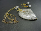 Tree Agate Heart Shaped Gemstone Pendant Gold Wire Wrapped with a White Background and Green and Grey Lines with Matching Earrings