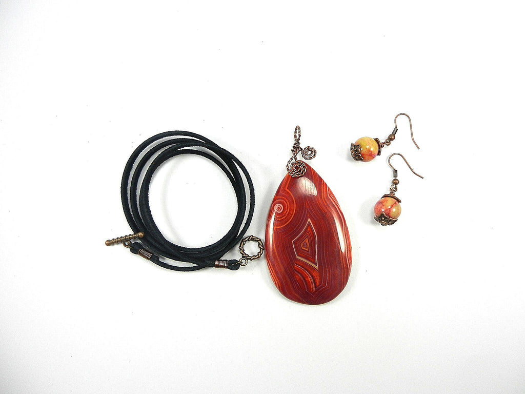 Orange Red Yellow and Cream Banded Agate Teardrop Gemstone Pendant with an Antique Copper Wire Wrapped Bail with Matching Agate Earrings and A Black Suede Necklace