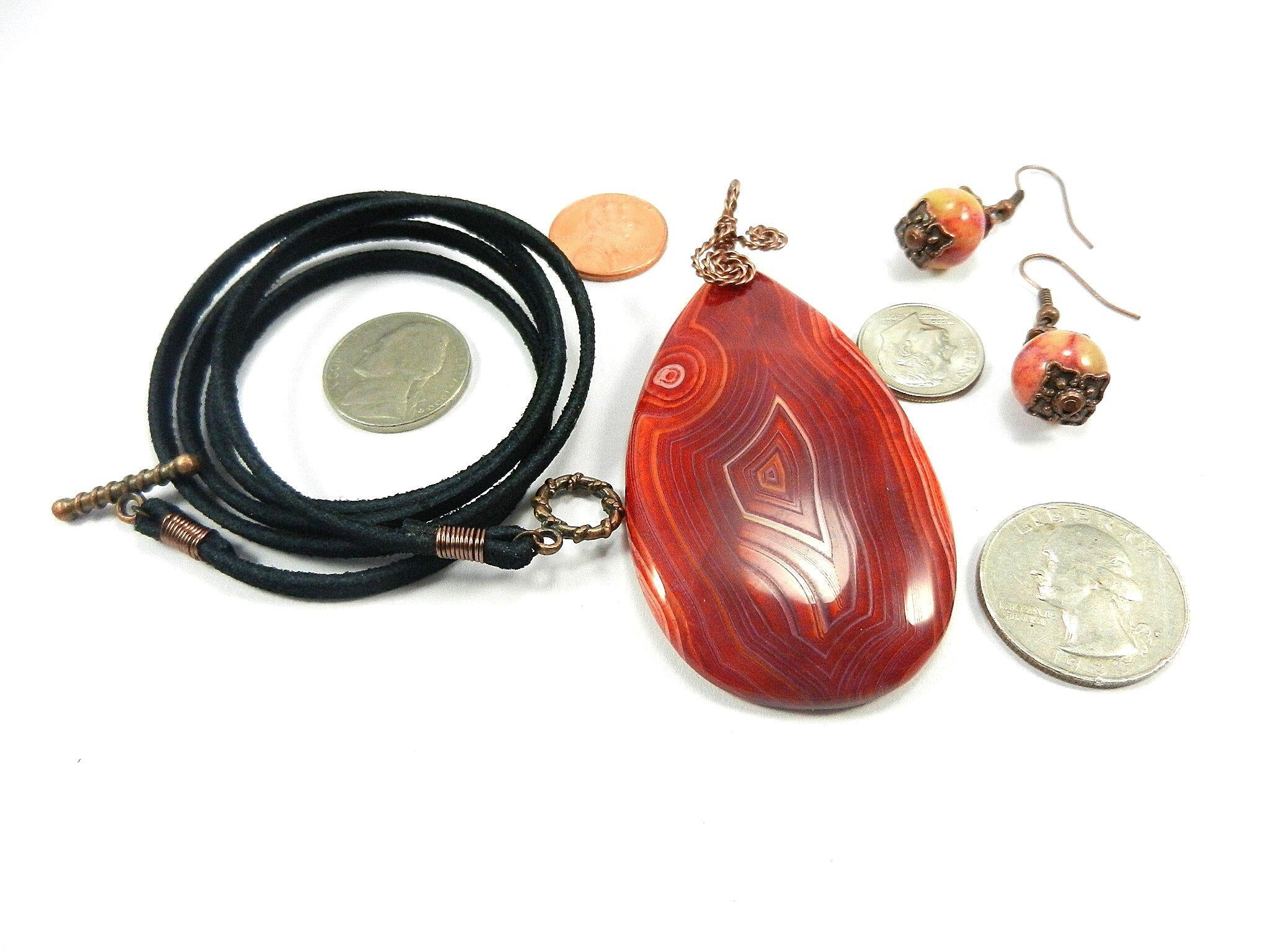 Orange Red Yellow and Cream Banded Agate Teardrop Gemstone Pendant with an Antique Copper Wire Wrapped Bail with Matching Agate Earrings and A Black Suede Necklace