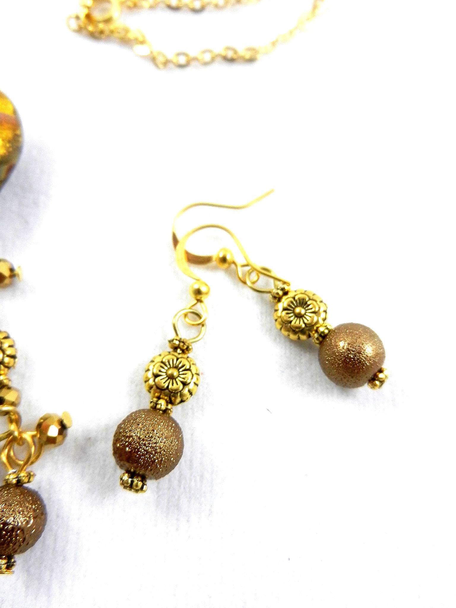Gold Lamp Work Heart Necklace with a Matching Bracelet and Earrings