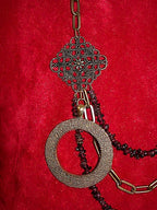Three Strand Garnet Asymmetrical Necklace and Earrings with a Bronze Pendant